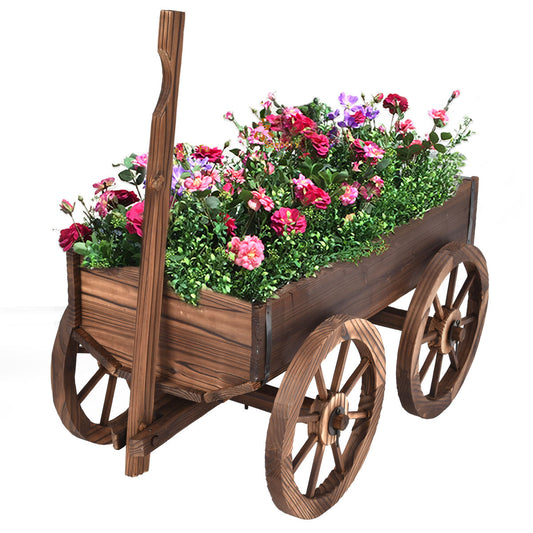 Wooden cart planter filled with colorful flowers on a white background